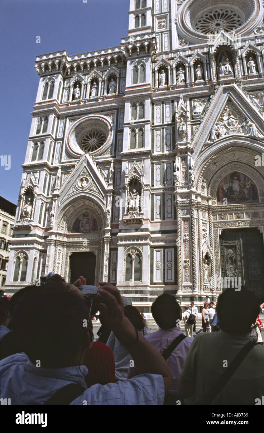 tourists making pictures of the dome cathedral of Santa Maria del Fiore ...