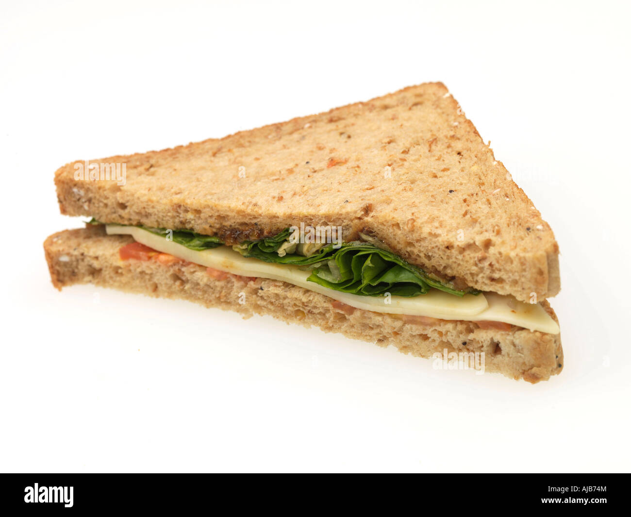 Fresh Cheese Pickle And Salad Ploughman's Sandwich On Brown Bread Isolated Against A White Background With A Clipping Path And No People Stock Photo