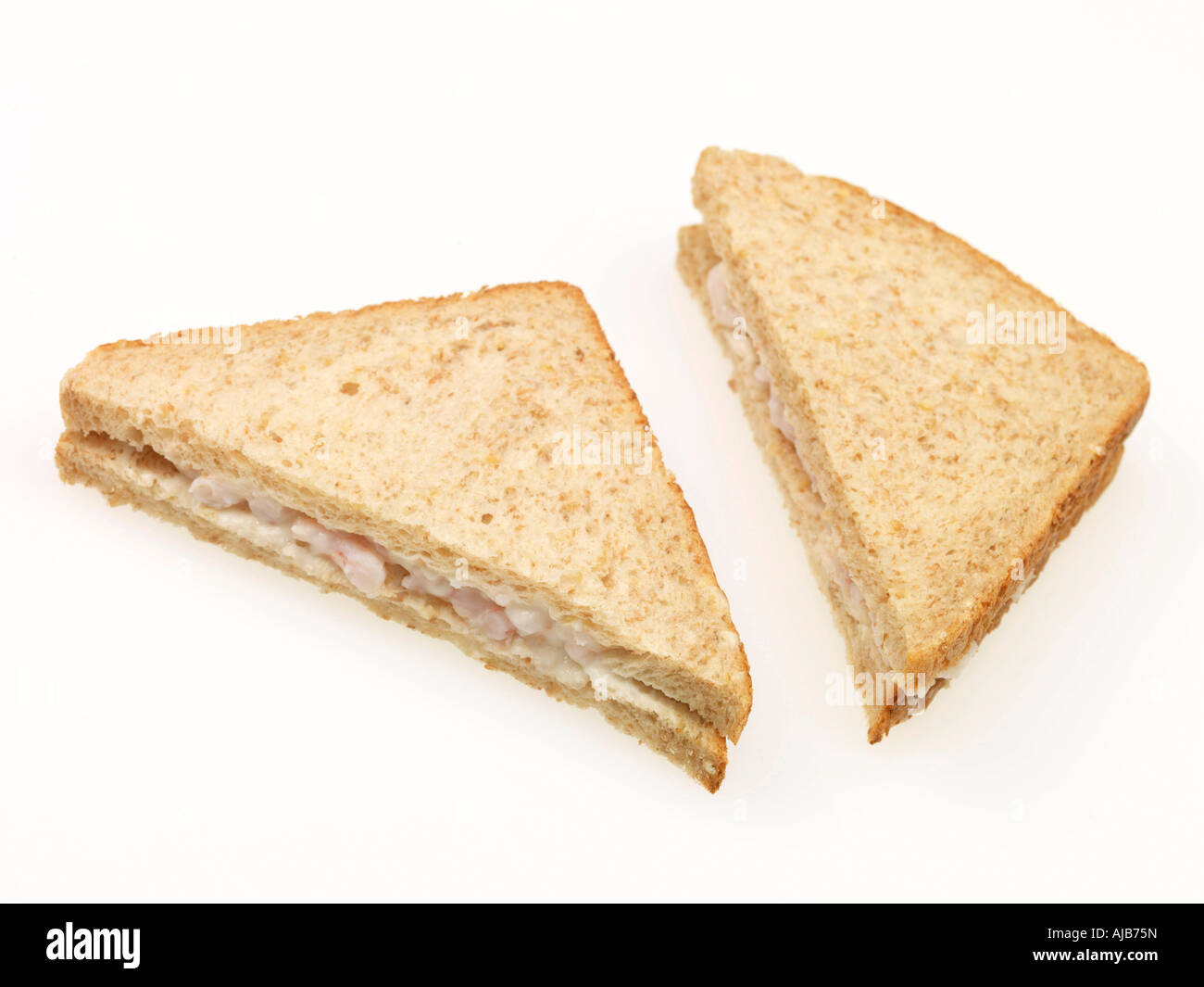 Fresh Prawn Mayonnaise Sandwich On Brown Bread Isolated Against A White Background With A Clipping Path And No People Stock Photo