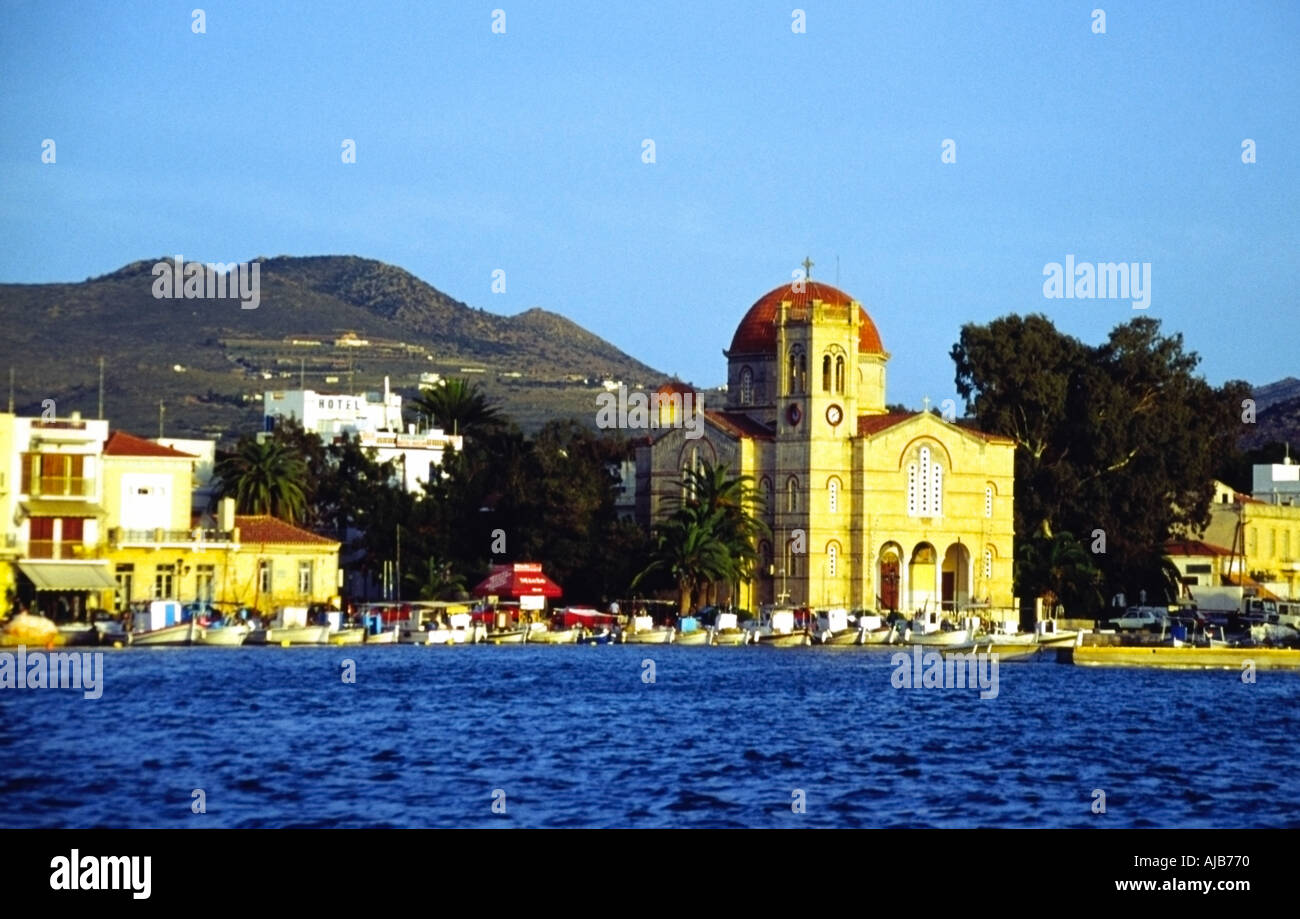church and fishing boats Aegina town harbour Greece Europe Stock Photo