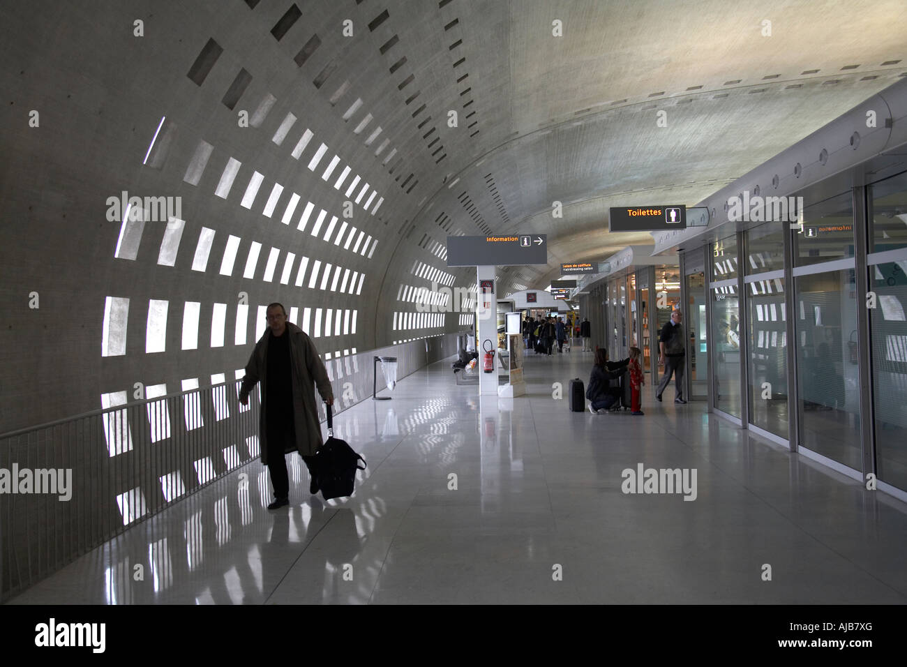 Passengers in Charles de Gaulle airport terminal 2 building interior Paris France Europe EU Stock Photo