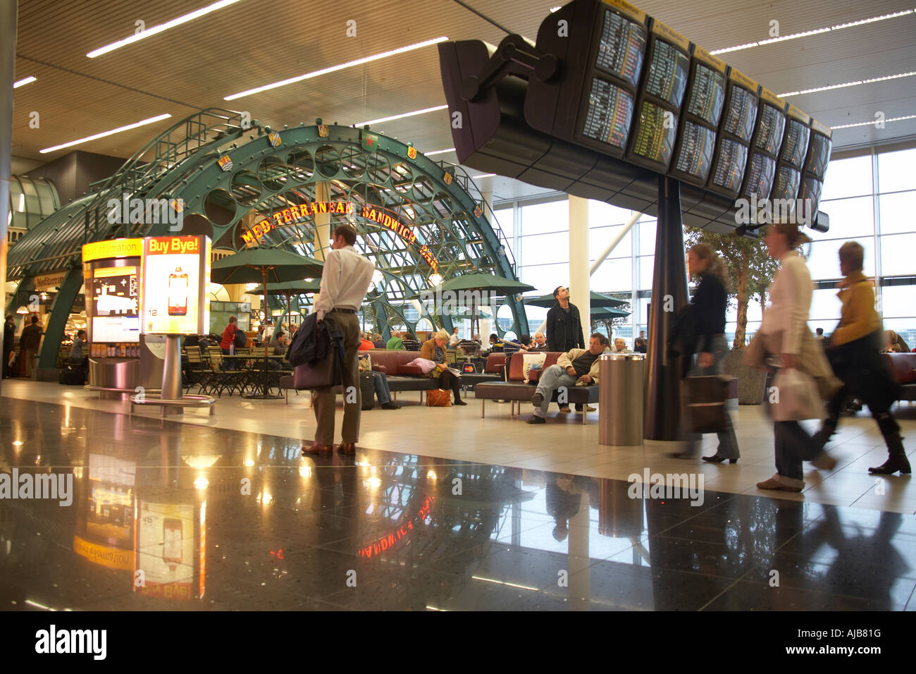 Schiphol airport terminal building interior information screens passengers Amsterdam Netherlands