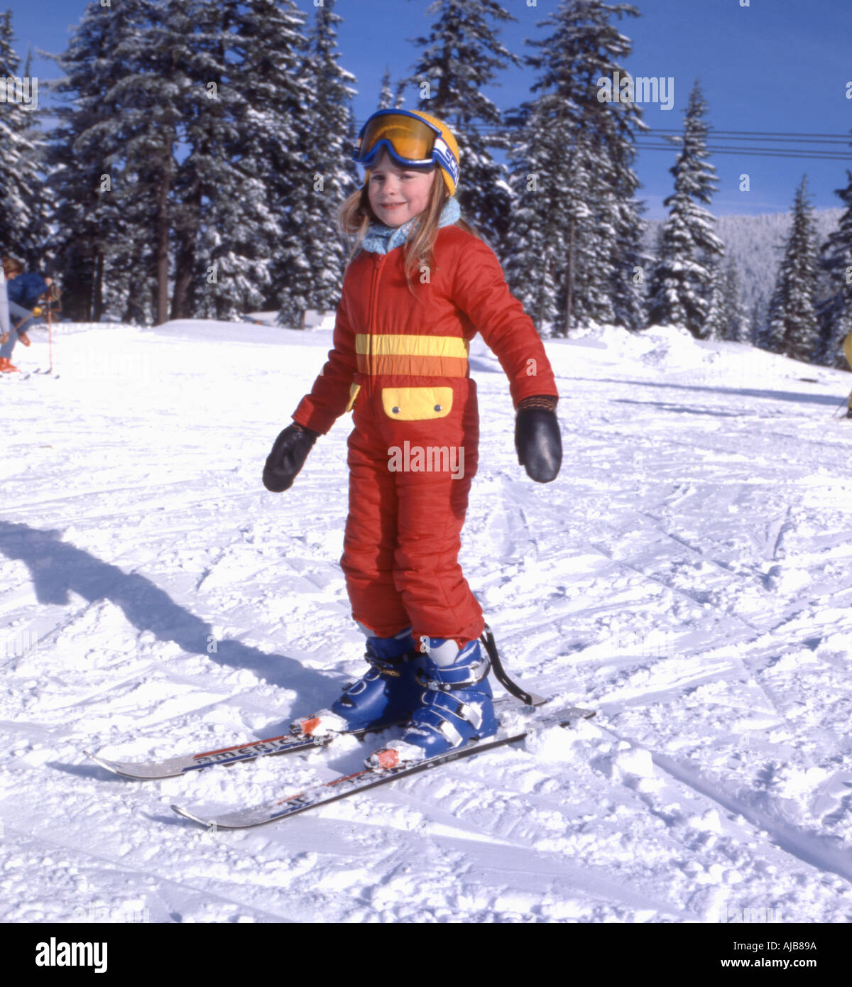 Young girl on her first outing on skis gets the feel of sliding on the snow Stock Photo