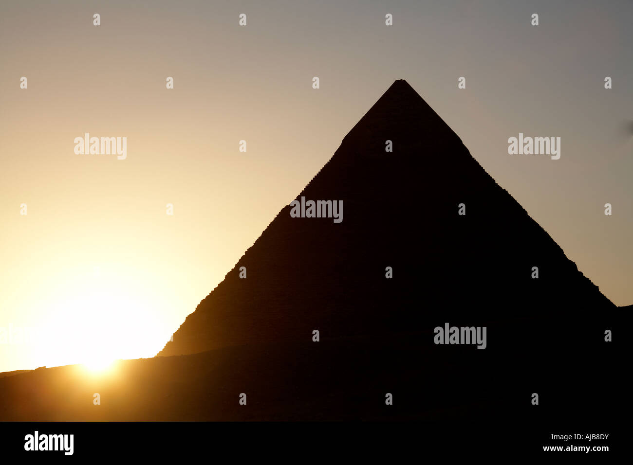 Pyramid of Khafre Chefren in silhouette with setting sun in evening at ...