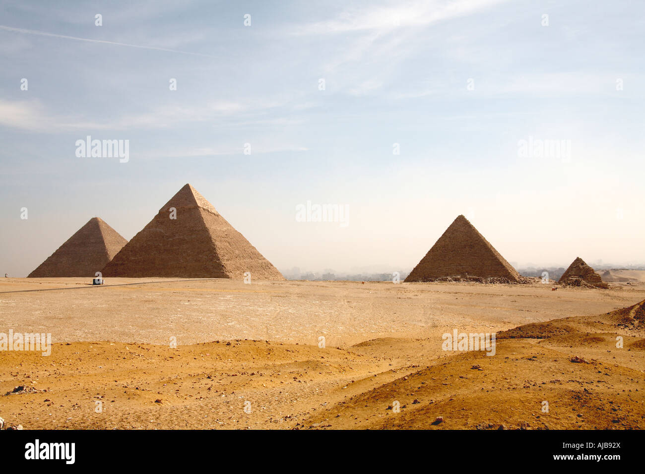 The pyramids viewed across stony desert from the south west Giza Cairo Egypt Africa Stock Photo