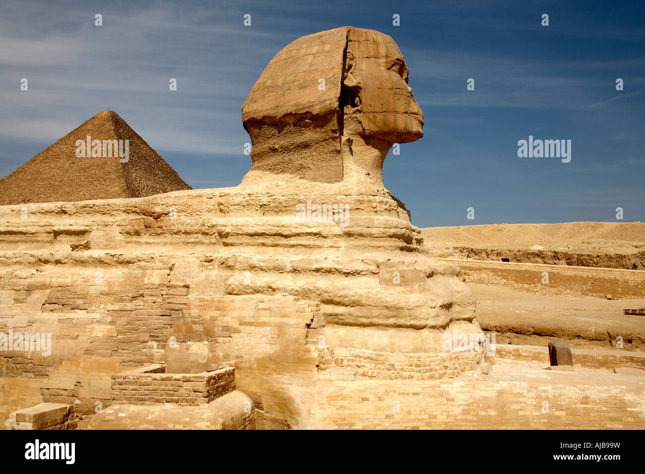 The Sphinx with Great Pyramid of Khufu Cheops in distance Giza Cairo ...