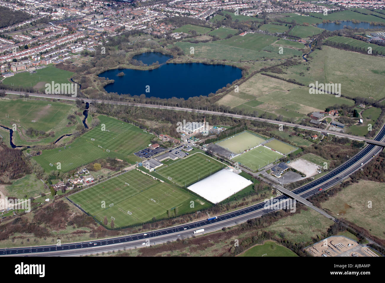 Aerial view north west of Ray Park sports ground and tennis courts M11 motorway Buckhurst Hill London IG9 England UK High level Stock Photo