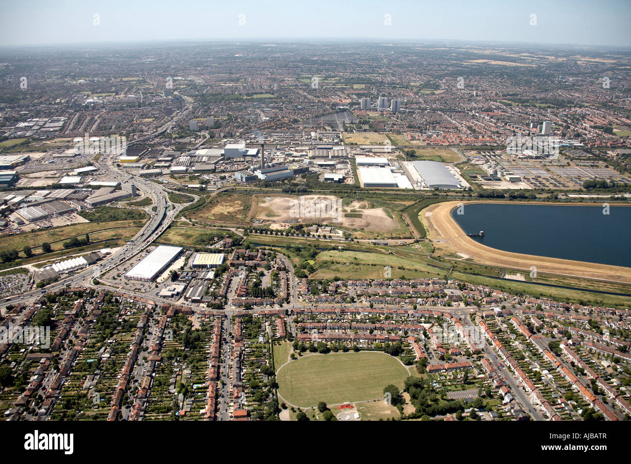 Aerial view east of A406 William Girling Reservoir Enfield London N9 N18 England UK High level oblique Stock Photo