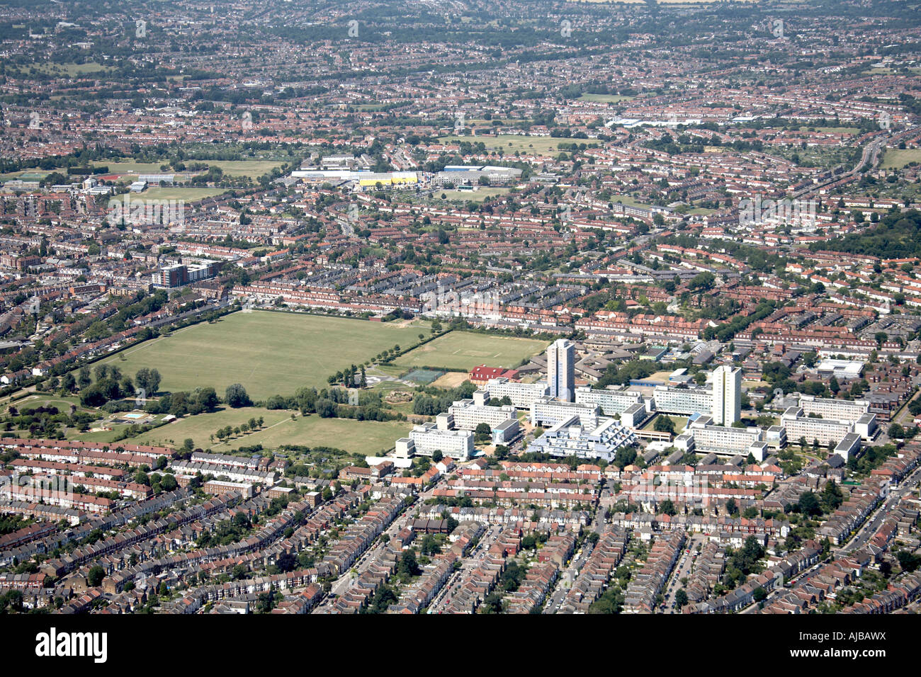 Aerial view west of Lordship Recreation Ground tower blocks and suburban housing Haringey London N17 England UK High level obli Stock Photo