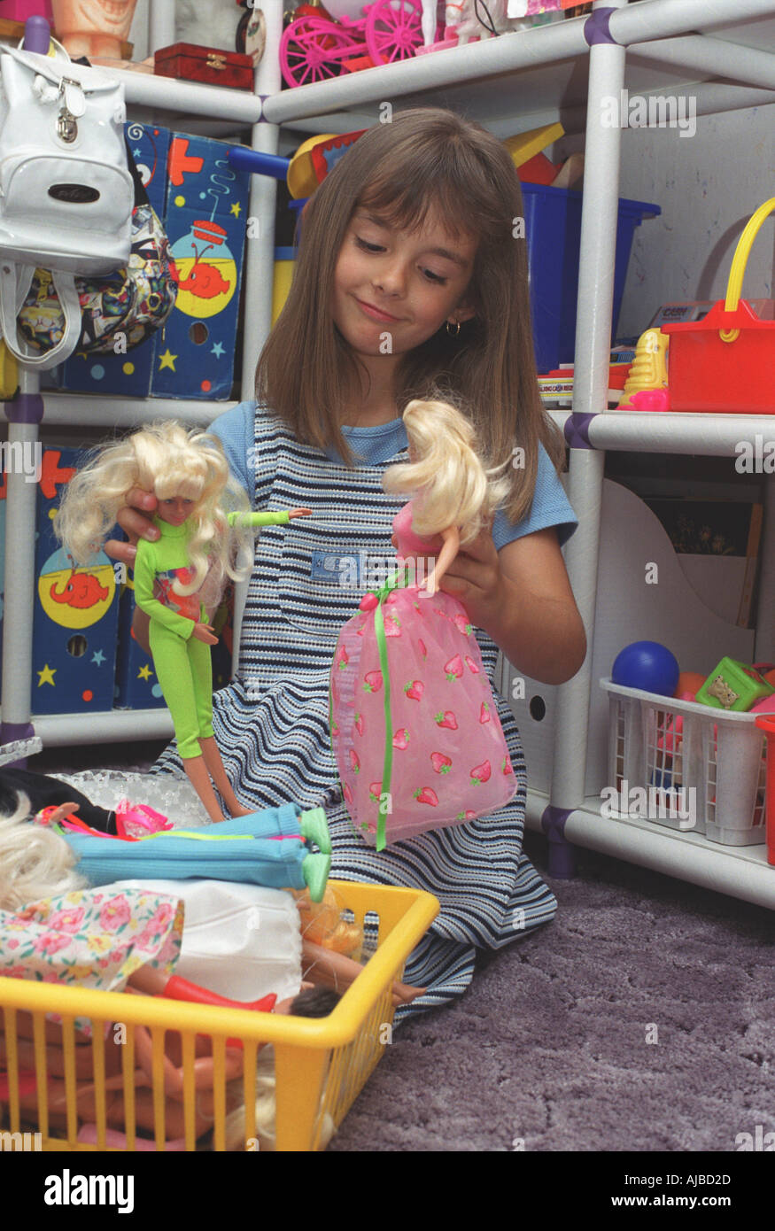 little girls playing with barbies