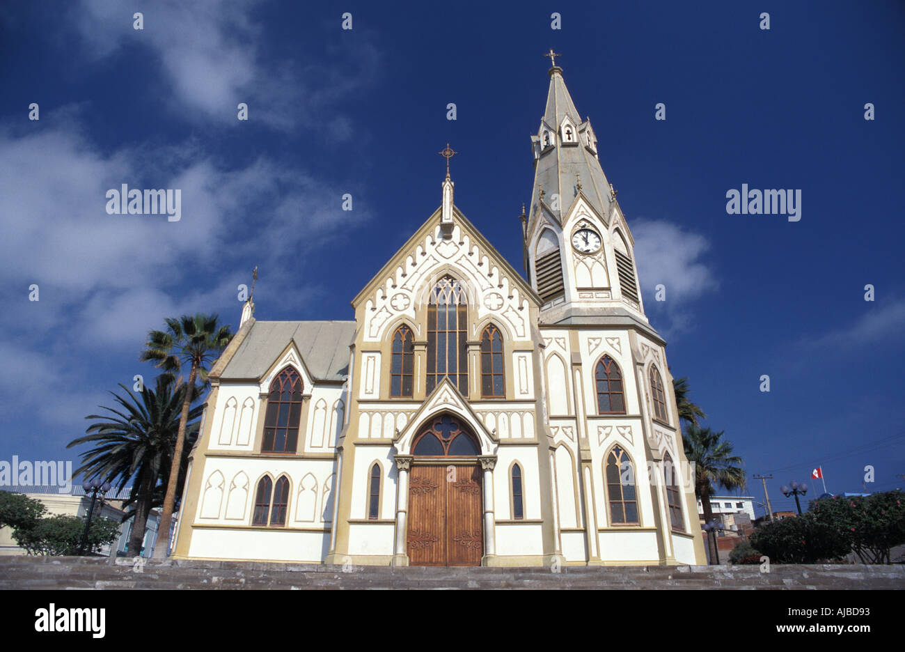 Iglesia San Marcos an attractive white church with gothic spire and arched windows Designed by Gustave Eiffel Arica Chile Stock Photo