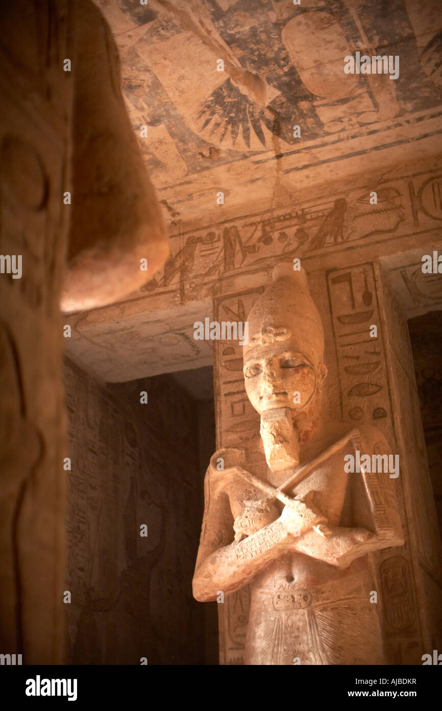 Giant carved stone statue of Ramses II portrayed as Osiris the god of the afterlife Temple of Abu Simbel Egypt Stock Photo