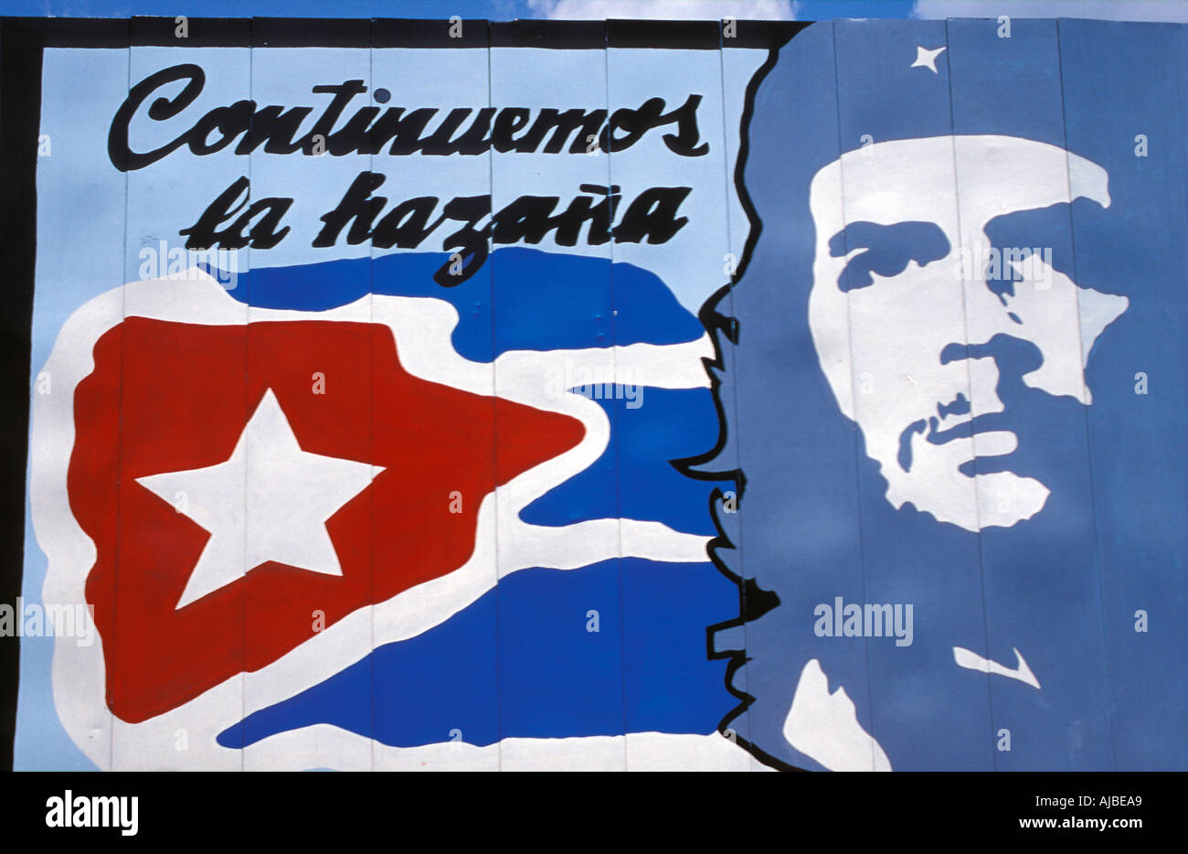 Cuban poster depicting national flag and Che vara la Hazaña We continue the achievements Cuba Che Guevara Stock Photo