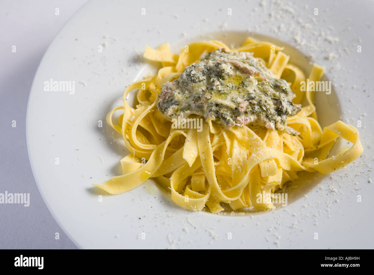 TAGLIATELLI WITH SAUCE OF SPINACH AND  NUT Stock Photo