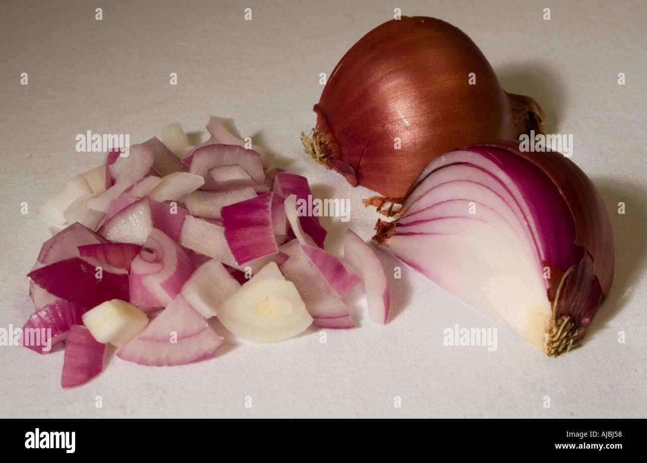 Red onion chopped quartered and halved showing both inside and outside texture Stock Photo Alamy
