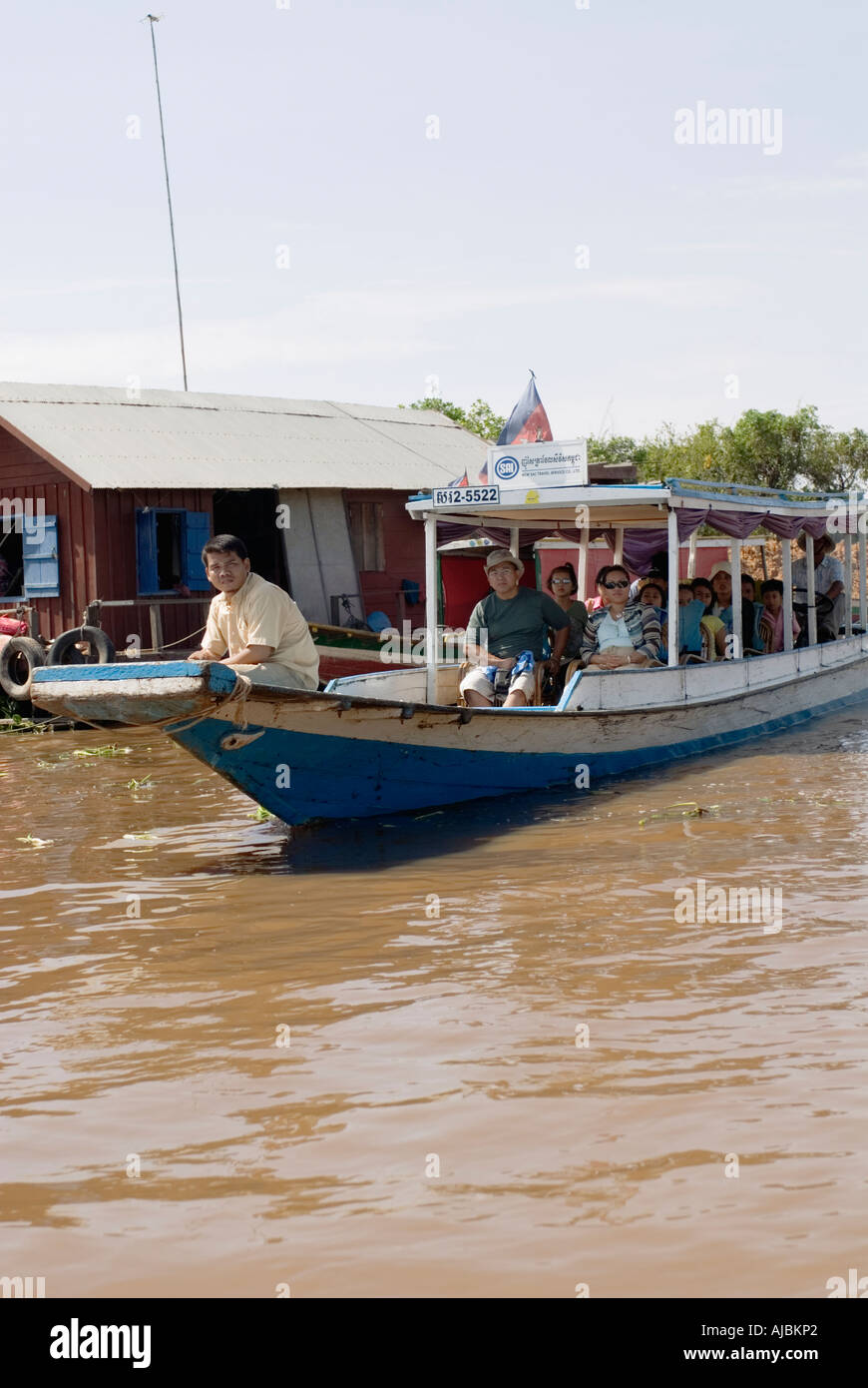 Cambodia Tourist Boat Sailing Through Chong Kneas Floating Village On Lake Tonle Sap Siem Reap Stock Photo