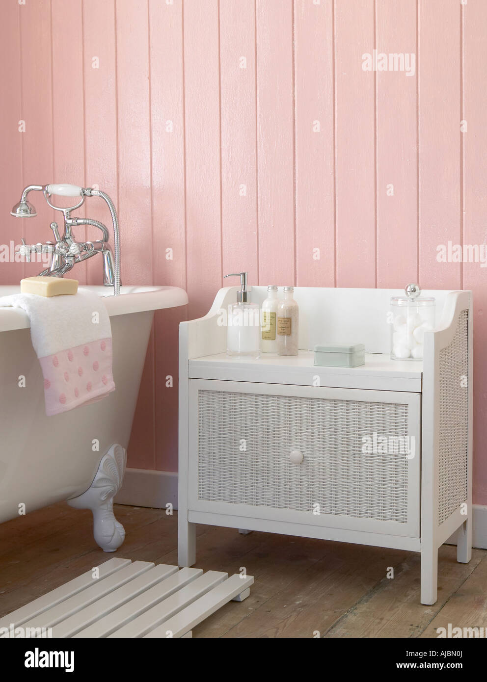 A Bathroom with a Rattan Side Cupboard Stock Photo Alamy