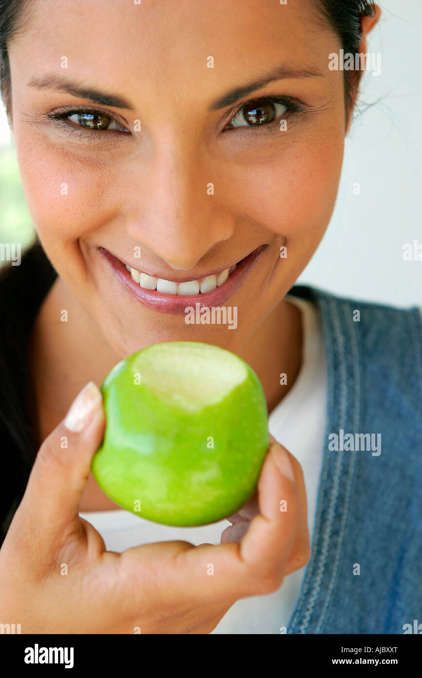 Portrait of an Indian Woman Holding a Fresh Green Apple Stock Photo