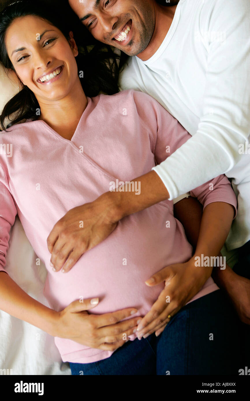 Portrait of a Pregnant Indian Couple - Directly Above Stock Photo
