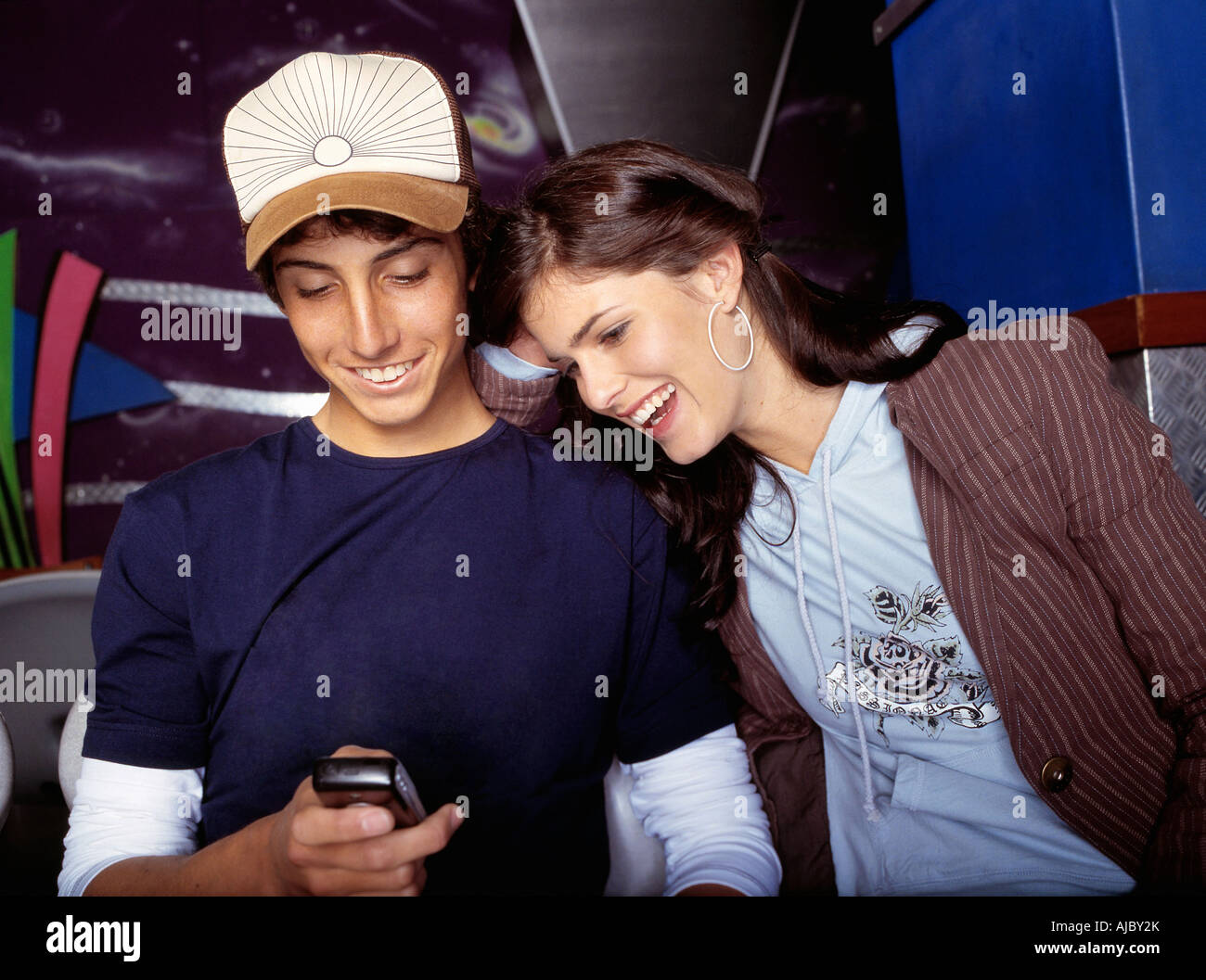 Portrait of a Teenage Couple on a Mobile Phone Stock Photo