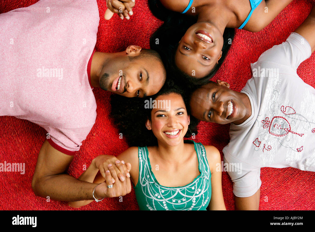 Two African Couples Head-to-Head - Directly Above Stock Photo