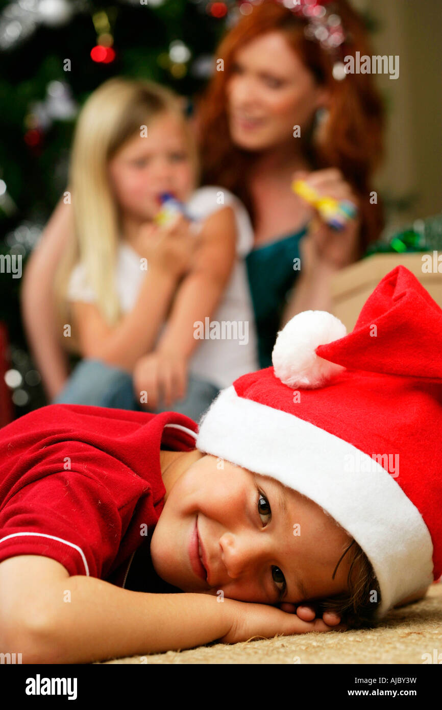 Portrait of a Young Boy Wearing a Christmas Hat Stock Photo