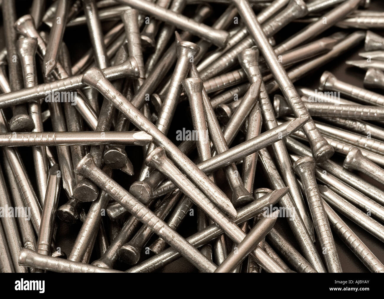 close up of nails for DIY made of iron and nailed into wood with a hammer  Stock Photo - Alamy