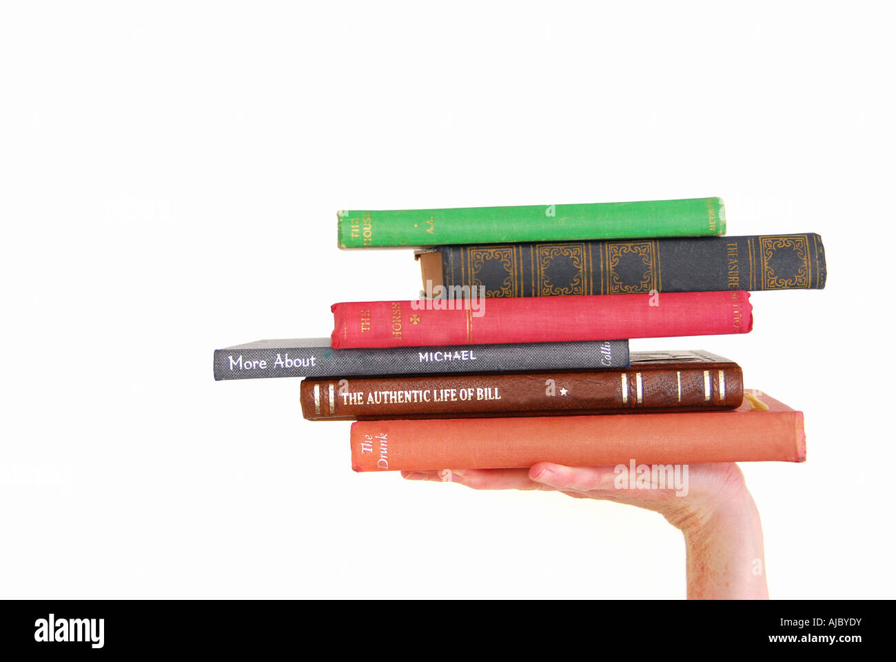 Young Woman Holding Up a Pile of Books Stock Photo - Alamy