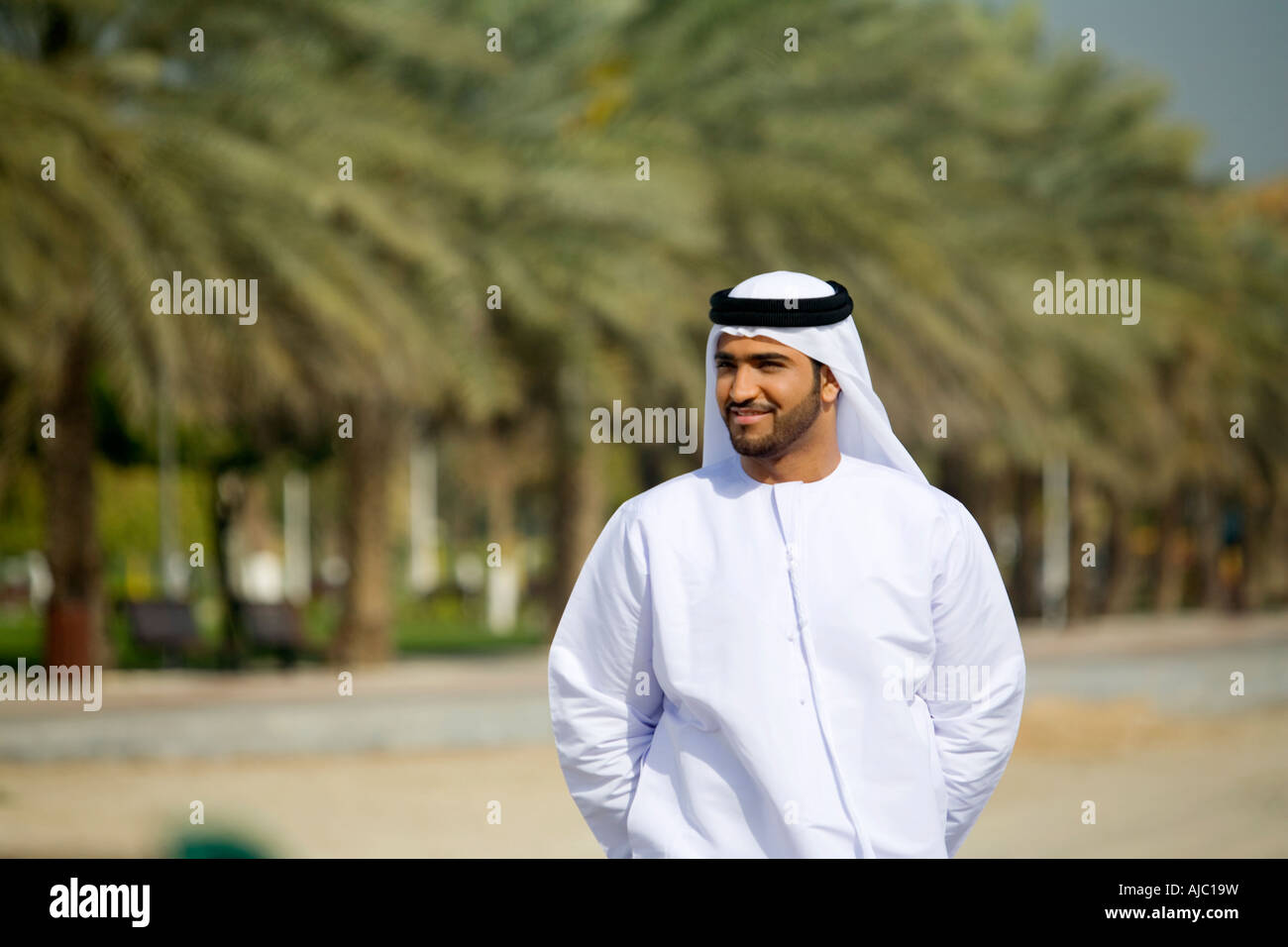 Arab Man Tree Smiling Arab Man Standing in Park Near Date Trees Stock Photo - Alamy