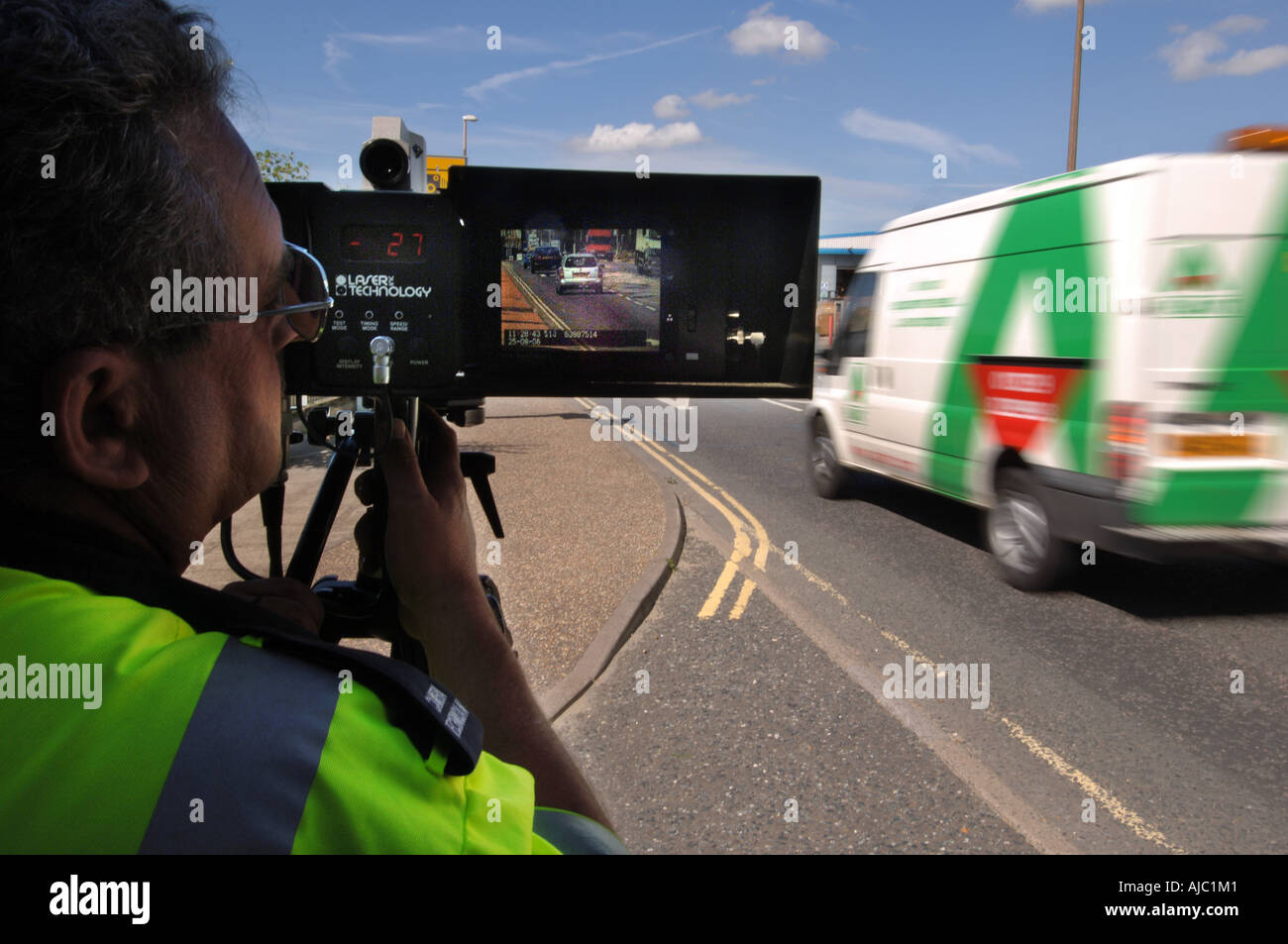 A Speed Safety Camera enforcement officer checks on speeding cars in a 30 limit area Stock Photo