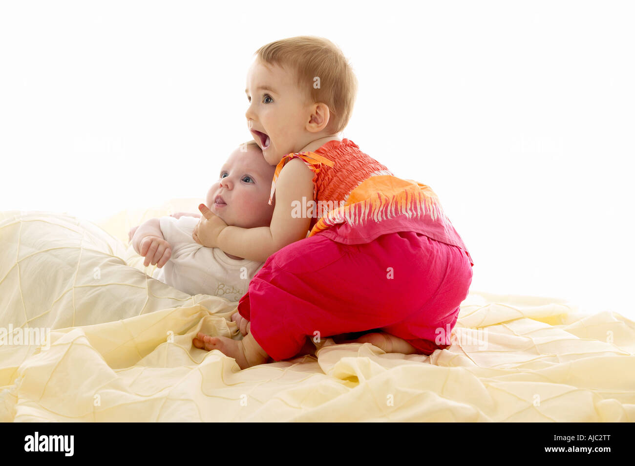 Portrait of a Baby Girl and Baby Boy - Excited Stock Photo