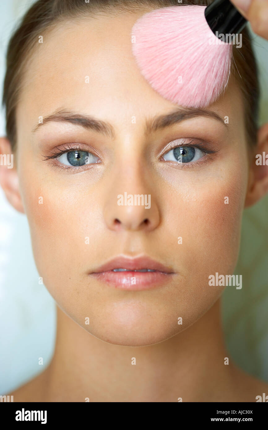 Woman Applying Make-Up Stock Photo
