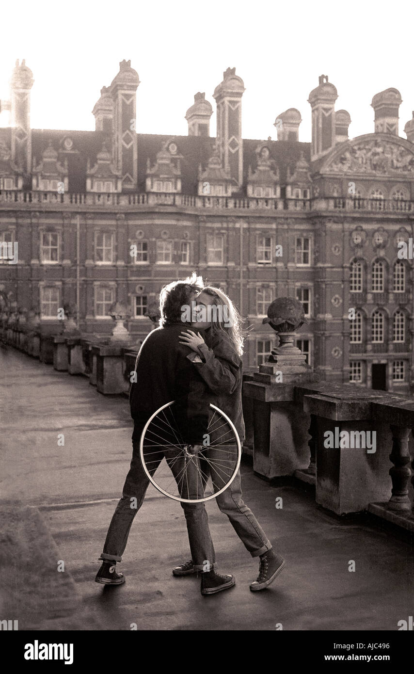 Friends embracing candid Royal Holloway College ex RHBNC Egham Surrey University of London England UK Stock Photo