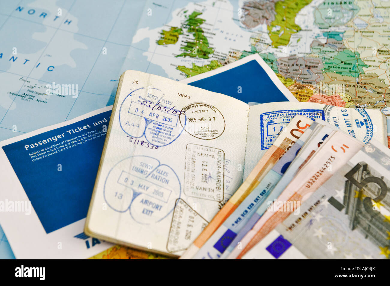 Airline Ticket with Passport and Foreign Currency Stock Photo