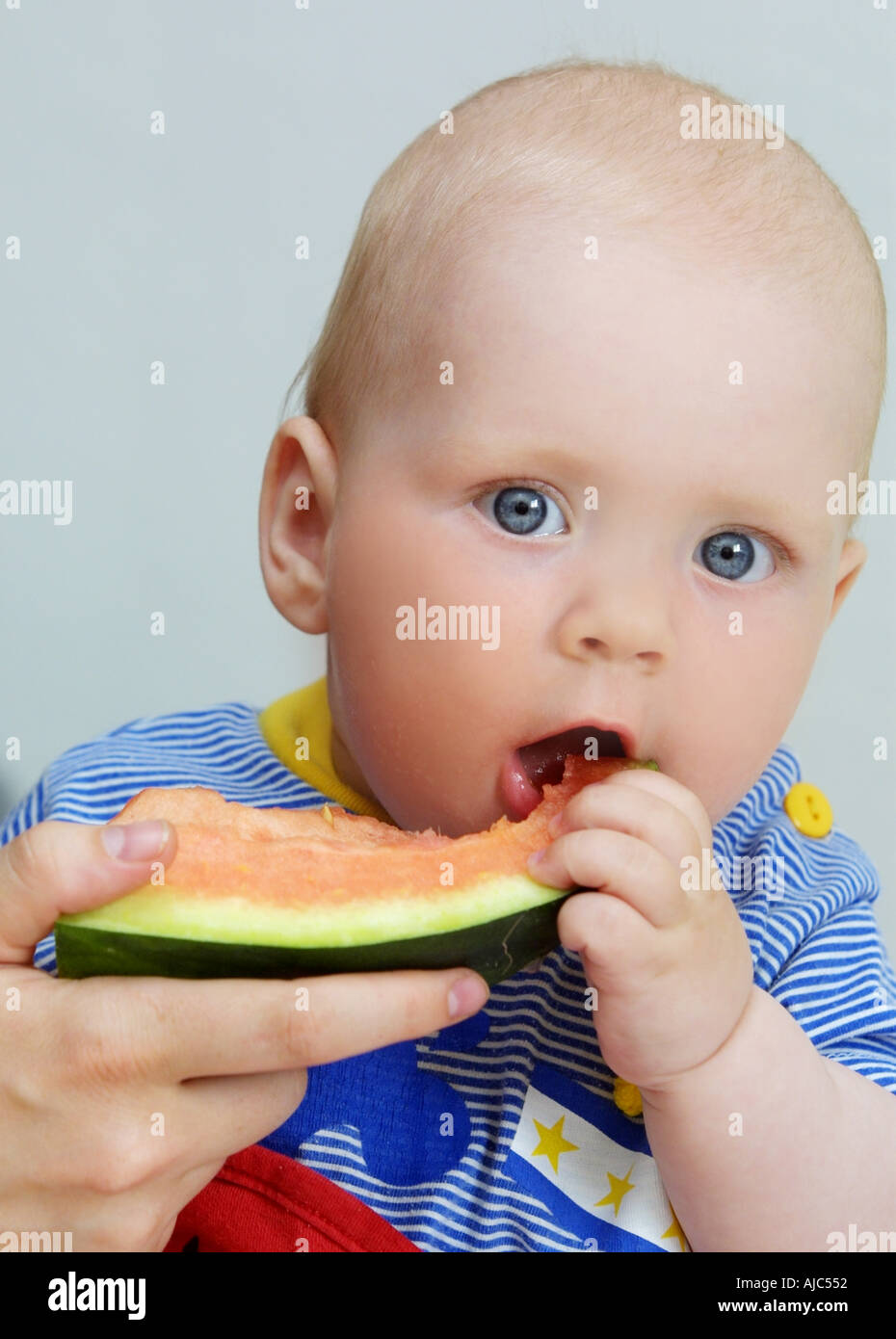 Little Baby Eating Melon Stock Photo Alamy