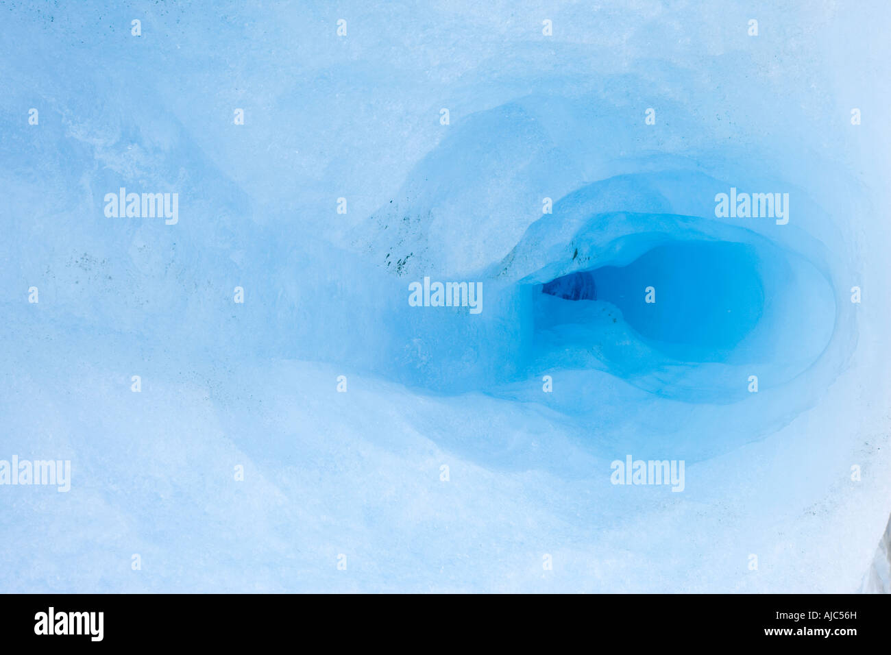 Beautiful Blue Coloured Detail of a Crevasse on Glacier Grey Stock Photo