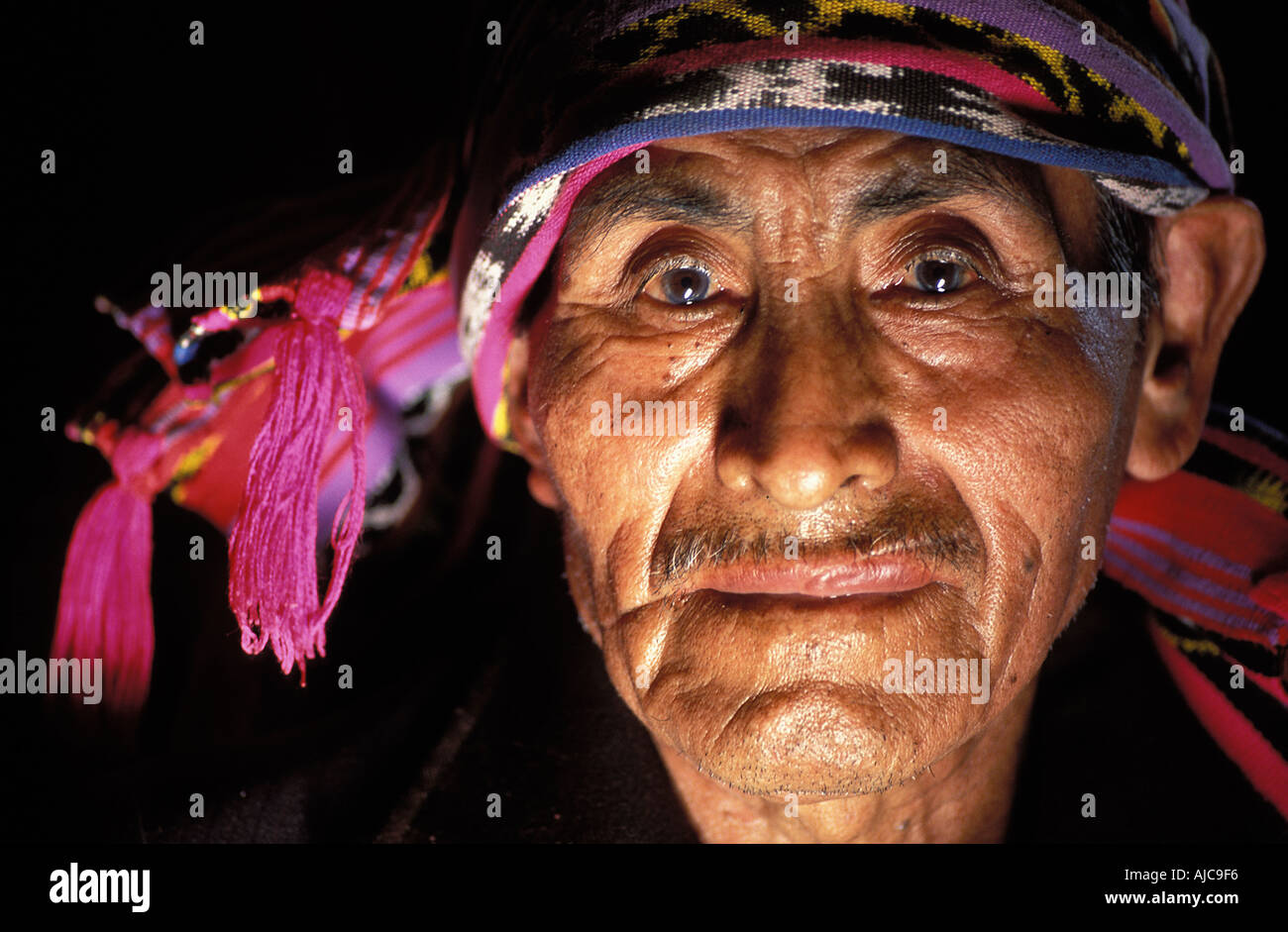 Religious Maya elder wearing a woven headcloh symbol of his authority Santiago Atitlan Guatemala Stock Photo