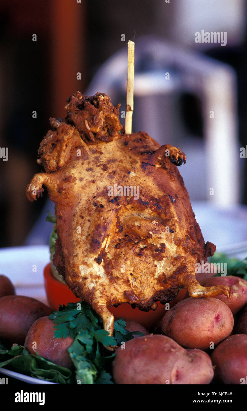 Deep fried Cuy guinea pig is an unusual Peruvian delicacy For sale at a local fiesta Carhuaz Northern Peru Stock Photo Alamy
