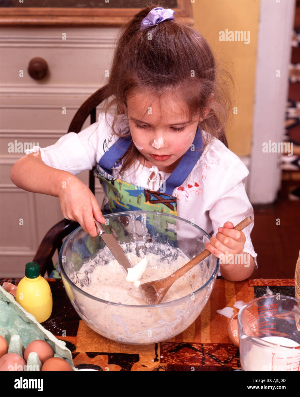 Child Baking a Cake in the Kitchen at Home Stock Photo Alamy
