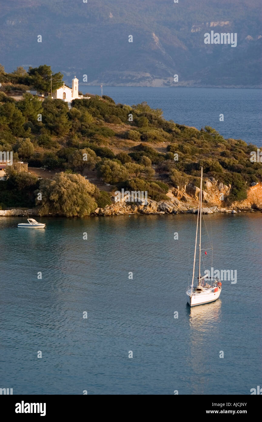 Boat and little church at the bay of Posidonio, samos island, greece. Stock Photo
