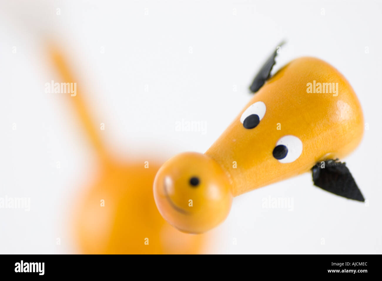 Close up view of a traditional wooden toy horse against a white background Stock Photo