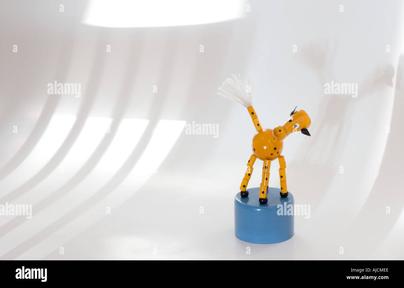 Close up view of a traditional wooden toy horse against a white background Stock Photo