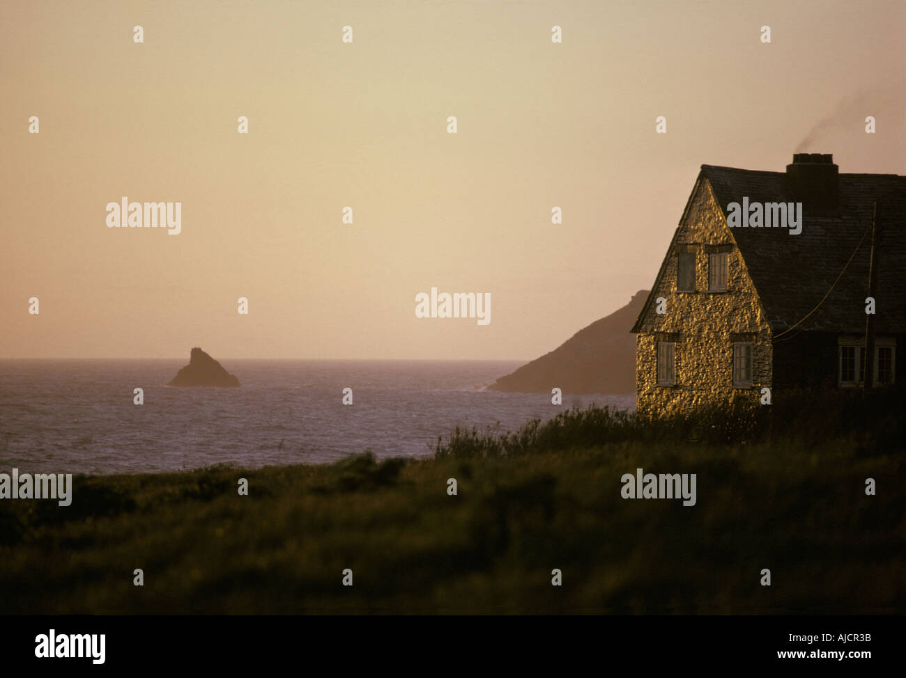 A house on the coast of Cornwall near Trevose Head in sunshine after storm Stock Photo