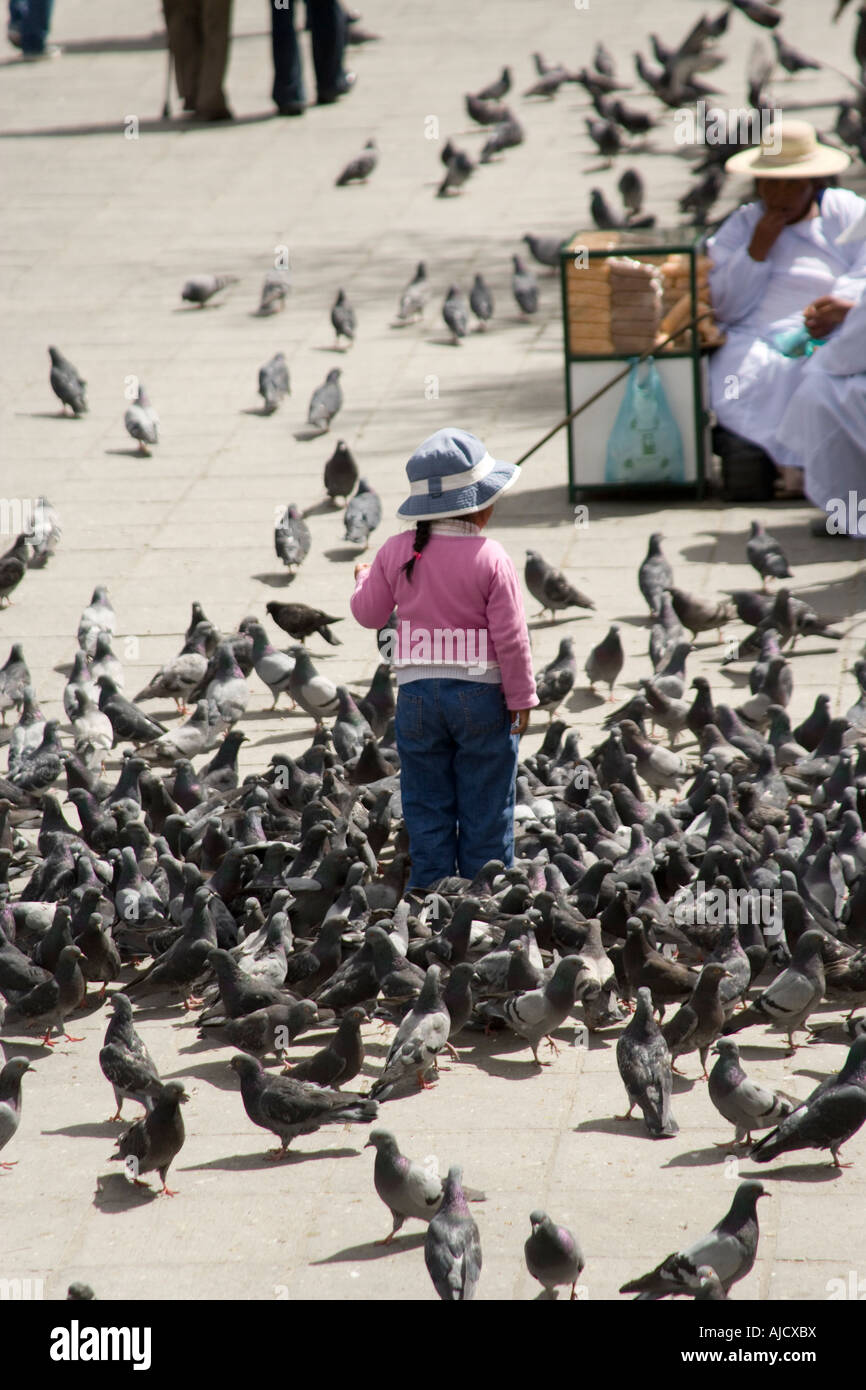 Little girl and pigeons in the Plaza Murillo, La Paz, Bolivia Stock Photo