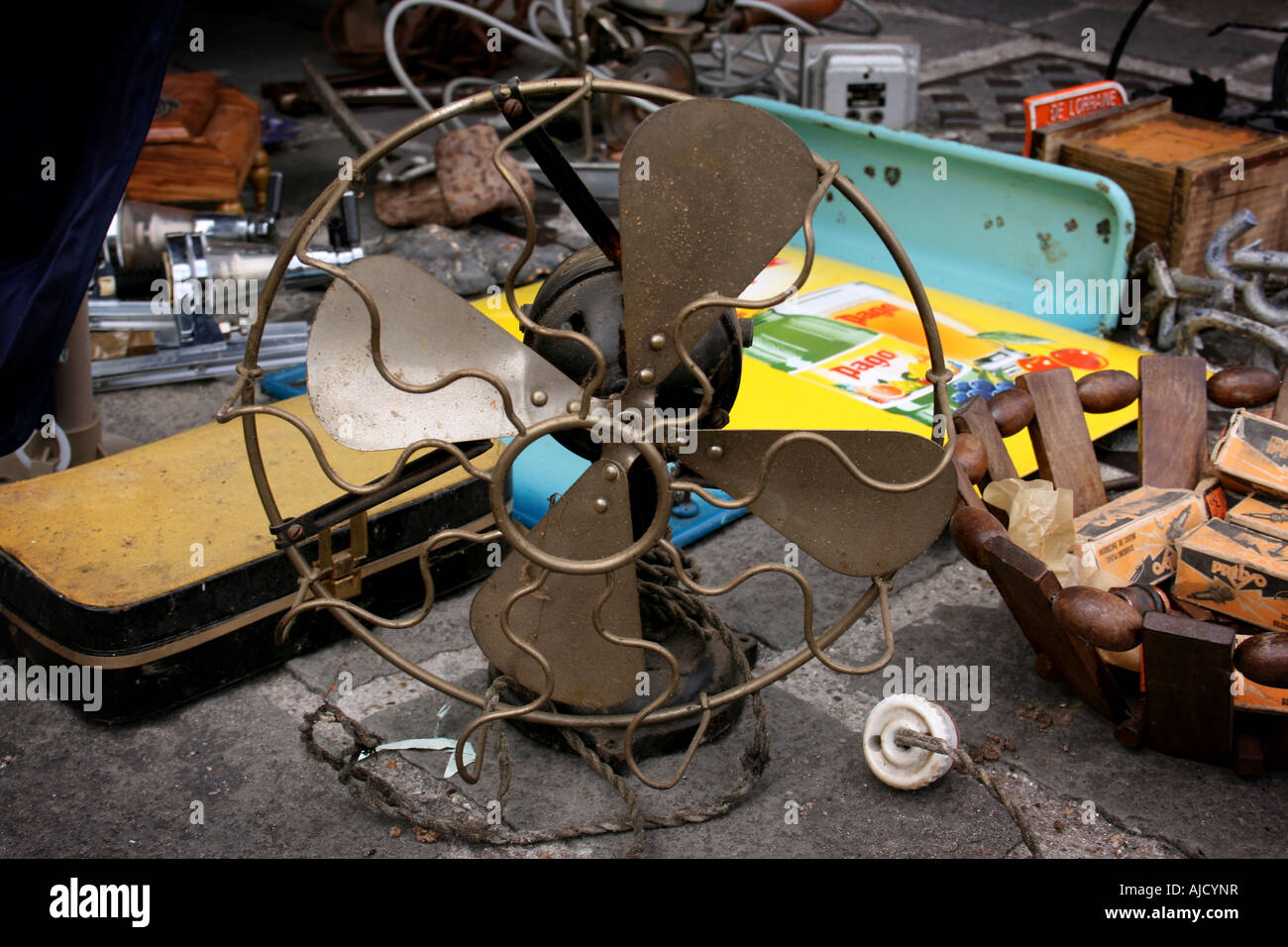 Old antique fan on the pavement of market stall at the Braderie, Lille
