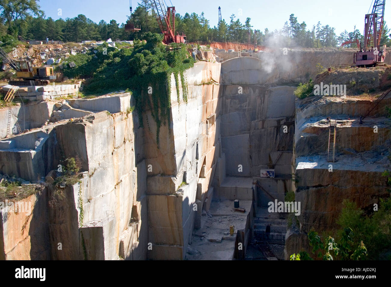 Workers drilling and cutting blocks at a granite quarry in Elberton