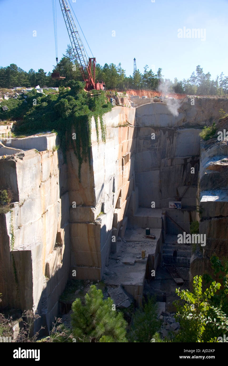 Workers drilling and cutting blocks at a granite quarry in Elberton