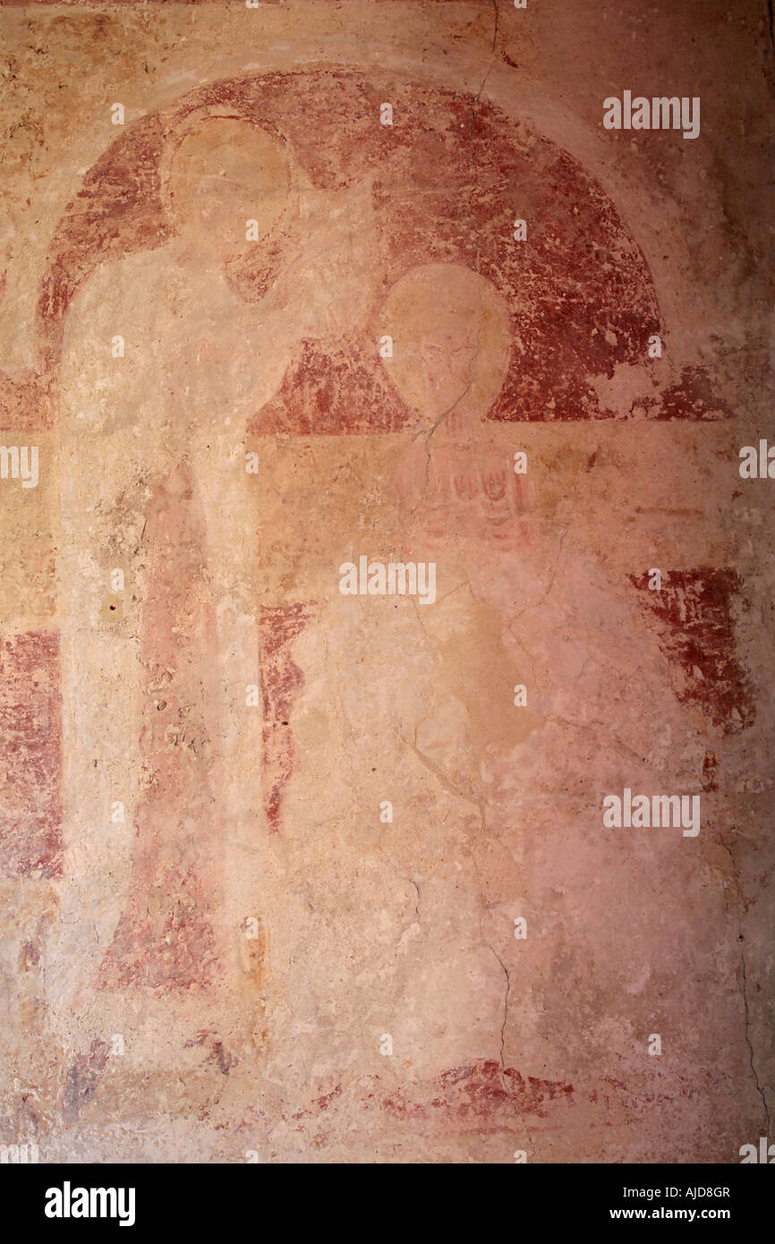 Early medieval wall painting depicting the Baptism of Christ. Location St Botolphs Church, Hardham, West Sussex. Stock Photo