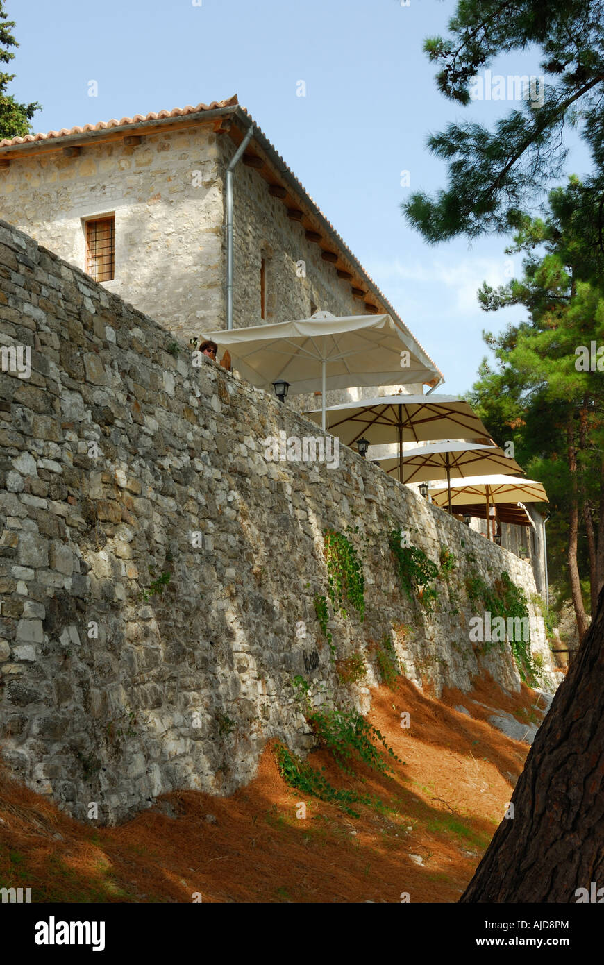 The old castle converted into a restaurant at Greek port of Parga Greece Stock Photo