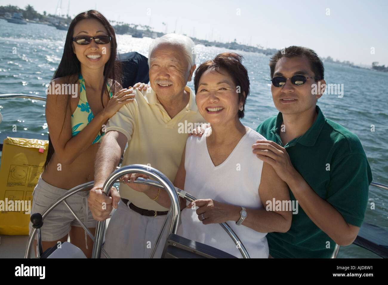 Son and daughter on small sailboat hi-res stock photography and images ...
